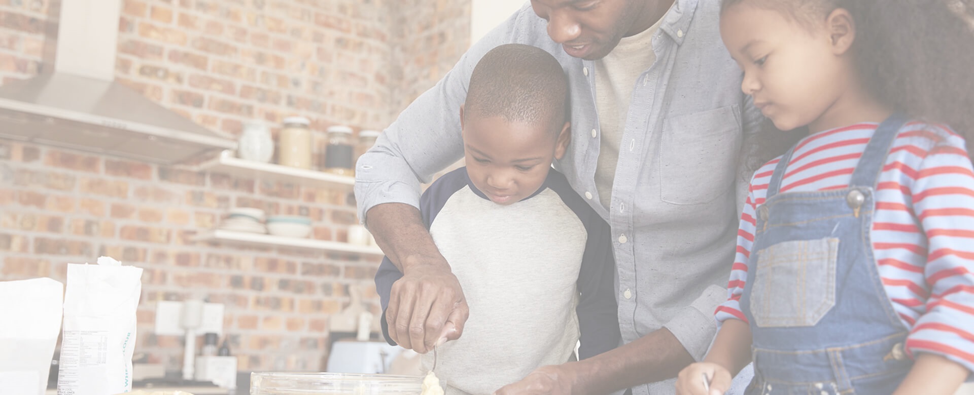 Father baking in kitchen with kids